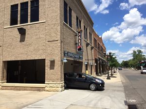 St. Paul, Grand at Victoria. Shared parking is located behind and above storefronts.