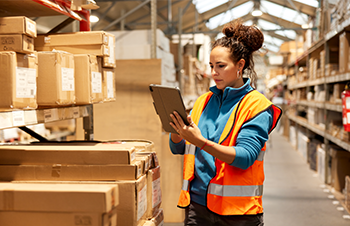 This is a woman fulfilling orders in a fulfillment center.
