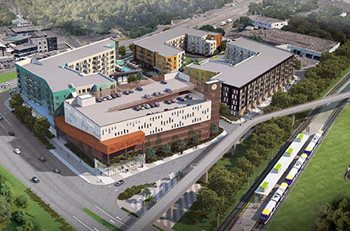 Aerial view of development includes three apartment buildings, a parking ramp, and commercial space on a 6.6-acre site.
