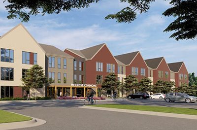 Architect’s rendering shows apartment building with several peaked roofs.