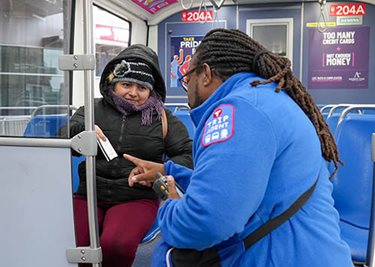 Agent checks passenger’s ticket.
