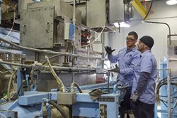 people working at a plant